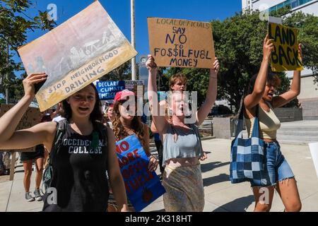 Los Angeles, United States. 23rd Sep, 2022. Climate protesters march with placards during a Global Climate Strike rally in Los Angeles. Youth and community organizers gather as part of a worldwide 'Global Climate Strike'' to call for divestment from fossil fuels and investment in green infrastructure, and to highlight ``what it's like to suffer on the frontlines of environmental racism and the climate crisis. Credit: SOPA Images Limited/Alamy Live News Stock Photo